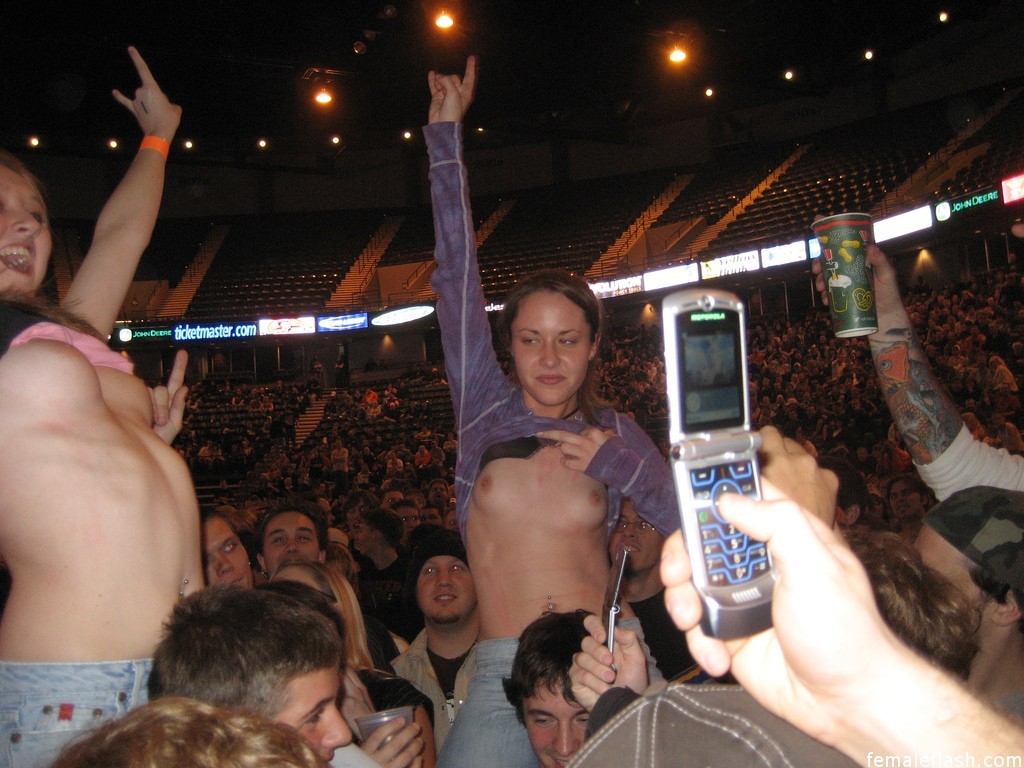 The girls flashing boobs at a rock concert.