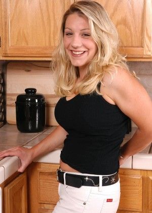 Busty blonde Brandy undresses in the kitchen