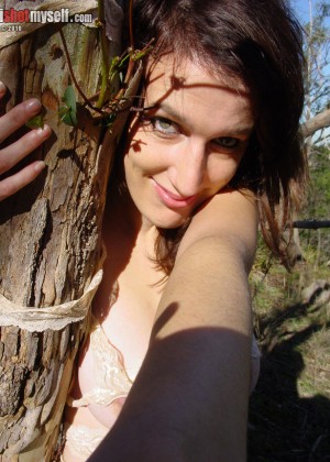 Busty girl with a hairy pussy in the woods with ropes and beads