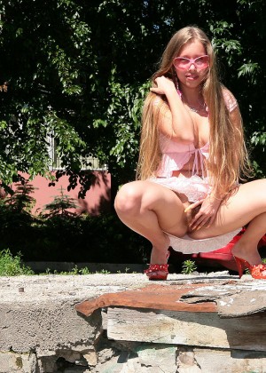 Teen Ukrainian Anna flashing hairy pussy outdoors